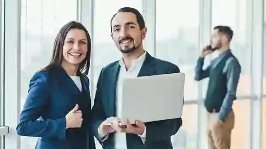 Team members working together and smiling