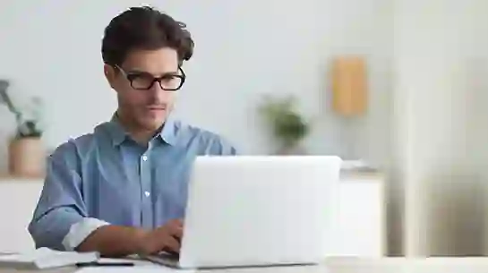 Man on computer working at home